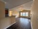 Sunlit living room featuring a ceiling fan, three windows, and a fireplace at 18267 Bridle Club Dr, Tampa, FL 33647