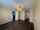 Open-concept floor plan features neutral walls, ceiling fan and wood flooring at 18267 Bridle Club Dr, Tampa, FL 33647