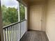 Exterior patio with a screened in porch and outside access at 18267 Bridle Club Dr, Tampa, FL 33647