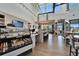 Community cafe with a bright and open layout featuring a beverage display, counter, and comfortable seating at 18636 Sailors Delight Pass, Land O Lakes, FL 34638