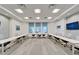 Modern conference room with a large table, chairs, and TV screen for presentations at 18636 Sailors Delight Pass, Land O Lakes, FL 34638