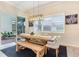The dining room has access to a screened-in patio through sliding glass doors at 18636 Sailors Delight Pass, Land O Lakes, FL 34638