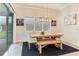 Bright dining room with modern wooden table, bench seating, and stylish décor at 18636 Sailors Delight Pass, Land O Lakes, FL 34638