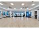 Spacious community center gym with various fitness equipment on a hardwood floor at 18636 Sailors Delight Pass, Land O Lakes, FL 34638