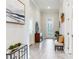 Inviting hallway featuring decorative art, a console table, and a comfortable bench, creating an elegant entrance at 18636 Sailors Delight Pass, Land O Lakes, FL 34638
