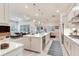Modern kitchen featuring a large center island, stainless steel appliances, and an open layout to the living area at 18636 Sailors Delight Pass, Land O Lakes, FL 34638