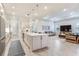 The expansive kitchen boasts a large island, stainless steel appliances, and open layout to the living room at 18636 Sailors Delight Pass, Land O Lakes, FL 34638