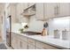 A modern kitchen with stainless steel appliances, white cabinets, subway tile backsplash, and a gas stovetop at 18636 Sailors Delight Pass, Land O Lakes, FL 34638
