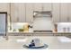 Bright kitchen with stainless steel appliances, shaker cabinets, a gas cooktop, and a stylish faucet at 18636 Sailors Delight Pass, Land O Lakes, FL 34638