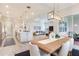 Spacious living area showcasing tile floors, recessed lighting, and a seamless transition to the gourmet kitchen at 18636 Sailors Delight Pass, Land O Lakes, FL 34638