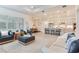 Open-concept living space with sightlines of the living room, dining area, and kitchen at 18636 Sailors Delight Pass, Land O Lakes, FL 34638