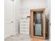 Indoor personal sauna room with tile floors, shelving and natural wood trim at 18636 Sailors Delight Pass, Land O Lakes, FL 34638