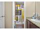 Neutral bathroom featuring decorative shower curtain, granite countertop, and tan walls at 19214 Early Violet Ne Dr, Tampa, FL 33647