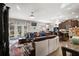 Open-concept living area flows seamlessly into the kitchen, featuring large windows and a sliding glass door at 19214 Early Violet Ne Dr, Tampa, FL 33647