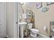Chic powder room with a pedestal sink, stylish fixtures, and elegant decor, perfect for guests at 19214 Early Violet Ne Dr, Tampa, FL 33647