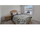 Bedroom featuring a patterned bedspread and natural light at 1967 Hovenweep Rd, Wesley Chapel, FL 33543