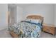 Bedroom featuring a patterned bedspread and natural light at 1967 Hovenweep Rd, Wesley Chapel, FL 33543