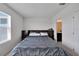 Bedroom with a queen bed with built-in drawers and view of the bathroom at 1967 Hovenweep Rd, Wesley Chapel, FL 33543