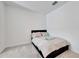 Cozy bedroom with a comfortable bed and neutral decor at 1967 Hovenweep Rd, Wesley Chapel, FL 33543