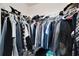 Walk-in closet with rod and shelf system to maximize storage of clothes at 1967 Hovenweep Rd, Wesley Chapel, FL 33543