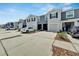 Row of townhouses with private garages and driveways surrounded by landscaping at 1967 Hovenweep Rd, Wesley Chapel, FL 33543