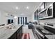 Open concept kitchen and living room with lots of light at 1967 Hovenweep Rd, Wesley Chapel, FL 33543