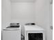 Laundry room featuring side-by-side washer and dryer units at 1967 Hovenweep Rd, Wesley Chapel, FL 33543