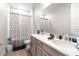 Neutral toned bathroom features a double vanity, and shower with tub combination at 20647 Ovid Ln, Venice, FL 34293