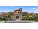 Beautiful clubhouse exterior showcasing stone accents, arched entryways and manicured landscaping at 20647 Ovid Ln, Venice, FL 34293