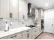 Detailed view of the modern kitchen with marble countertops and stainless steel appliances at 20647 Ovid Ln, Venice, FL 34293