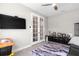 Home office with glass French doors, hardwood floors, and a ceiling fan at 20647 Ovid Ln, Venice, FL 34293