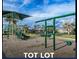 Outdoor playground with swings, slides, and climbing structures for recreational activities at 20647 Ovid Ln, Venice, FL 34293