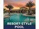 Resort-style pool with inviting blue water and tropical palm trees at 20647 Ovid Ln, Venice, FL 34293