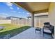 Back patio featuring outdoor furniture, a grill, and a view of the backyard at 22287 Storybook Cabin Way, Land O Lakes, FL 34637