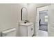 Stylish bathroom features a modern vanity with black fixtures and a well-lit mirror at 22287 Storybook Cabin Way, Land O Lakes, FL 34637