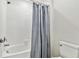 Modern bathroom featuring a shower/tub combination and tiled walls at 22287 Storybook Cabin Way, Land O Lakes, FL 34637