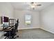 Bright bedroom features neutral walls, carpet, window with blinds, and ceiling fan, creating a comfortable atmosphere at 22287 Storybook Cabin Way, Land O Lakes, FL 34637