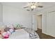 Bright bedroom with a ceiling fan, carpet, and closet at 22287 Storybook Cabin Way, Land O Lakes, FL 34637