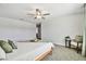 Bedroom with a modern ceiling fan, soft carpet, a tranquil view, and neutral decor creates a calm space at 22287 Storybook Cabin Way, Land O Lakes, FL 34637