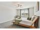 Bedroom features a modern ceiling fan, large window, soft carpet, and neutral decor offers a tranquil retreat at 22287 Storybook Cabin Way, Land O Lakes, FL 34637