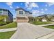 Charming two-story home featuring a two-car garage, neutral color palette and well-manicured landscaping at 22287 Storybook Cabin Way, Land O Lakes, FL 34637