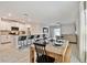 Open concept living space featuring a modern kitchen, breakfast bar, dining and living areas with lots of natural light at 22287 Storybook Cabin Way, Land O Lakes, FL 34637
