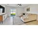 Bright living room with neutral decor, stylish rug, and sliding glass doors leading to the backyard at 22287 Storybook Cabin Way, Land O Lakes, FL 34637