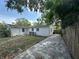 A long driveway leads to the back of this home surrounded by shady trees at 2315 Carroll Pl, Tampa, FL 33612