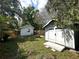 A spacious backyard features a fire pit and shed at 2315 Carroll Pl, Tampa, FL 33612