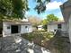Spacious backyard featuring outbuildings and a patio perfect for outdoor entertaining at 2315 Carroll Pl, Tampa, FL 33612