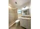 Bathroom featuring tiled shower, granite vanity, and modern fixtures at 2315 Carroll Pl, Tampa, FL 33612