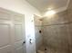Bathroom featuring tiled shower with neutral ceramic tiles at 2315 Carroll Pl, Tampa, FL 33612