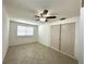 Bright bedroom features a ceiling fan, tiled flooring, natural light and a closet at 2315 Carroll Pl, Tampa, FL 33612