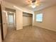 The bright bedroom includes a window and closet in addition to tile flooring at 2315 Carroll Pl, Tampa, FL 33612